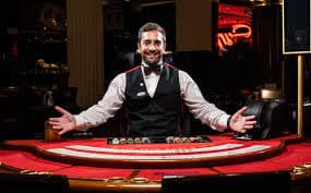 Live dealer studio with multi-camera setup showing table limits and dealer interaction